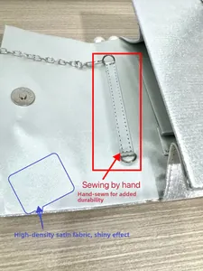 Detail of silver evening bag with smooth satin lining and magnetic snap closure