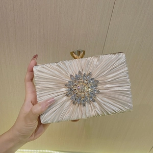 Elegant champagne pleated satin evening clutch bag with crystal flower brooch and gold clasp