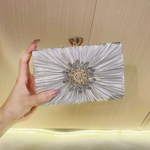 Silver pleated satin evening clutch bag with radial rhinestone flower and jewel clasp