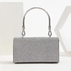 Luxurious silver rhinestone clutch bag with metallic ring handles and elegant box structure