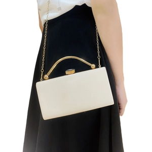 Elegant white evening clutch bag with gold handle and crystal clasp for weddings
