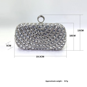 Elegant silver evening clutch bag with wave-patterned rhinestones and a circular ring handle
