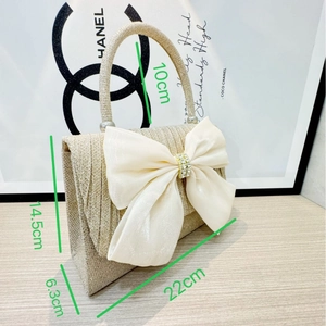 Champagne pleated evening handbag with large white satin bow and rhinestone center