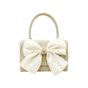 Champagne gold glitter evening clutch bag with oversized white bow and crystal detail