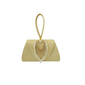 Close-up of golden evening clutch with luxury teardrop rhinestones and glitter finish