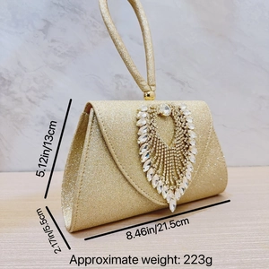 Close-up of champagne gold evening bag with rhinestone cluster and size measurements