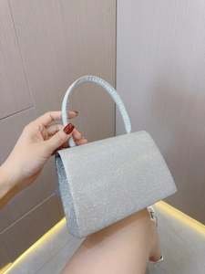 Silver sequin trapezoid evening bag with metallic glitter and arc top handle detail