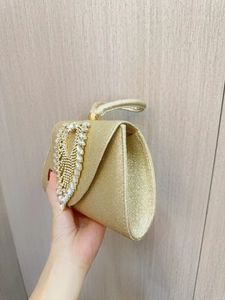 Luxury gold evening handbag with sequins and diamond encrusted design for gala events