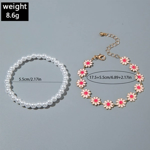 Detail of pink enamel daisy chain and pearl beaded bracelet set with size measurements