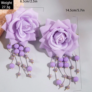 Detail view of purple rose earrings with beaded tassels showing 14.5cm length dimensions