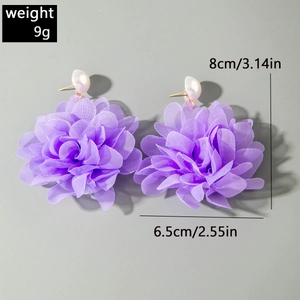 Detail view of purple tulle flower earrings with white pearls and size measurements