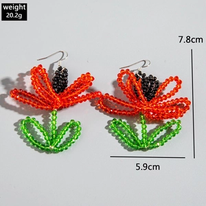 Detail view of handmade bohemian floral beaded earrings with dimensions 7.8cm by 5.9cm