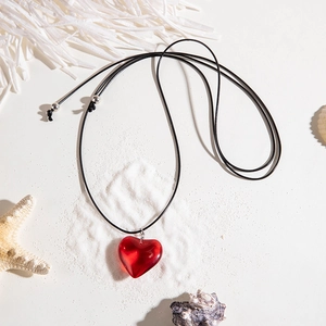 Minimalist red 3D heart pendant necklace with adjustable black cord and silver beads