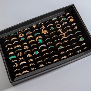 80-piece vintage gold ring set with emerald gems and star moon charms in velvet display box