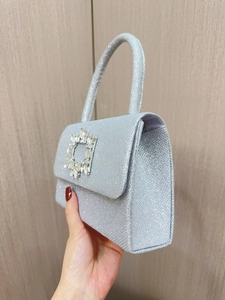 Sparkling silver sequin evening bag with a square crystal buckle for luxury party looks