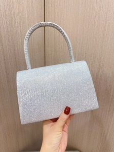 Elegant silver sequin evening clutch bag with round handle for weddings and formal parties