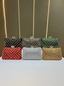 Close-up of luxury rhinestone evening clutch bags in six vibrant colors with V-pattern
