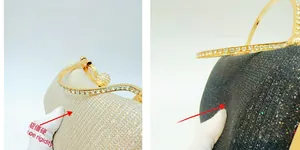 Detail view of the rhinestone buckle and wavy metal frame on luxury evening clutch bags