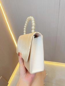 Elegant pleated champagne satin evening clutch bag with luxury faux pearl handle