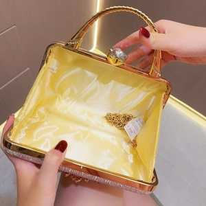 Sparkling gold rhinestone shell-shaped evening clutch bag with spiral metal handle