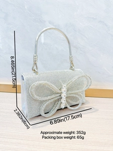 Bolso de noche plateado con pedrería, adorno de mariposa y asa circular de metal