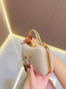 Champagne gold evening bag with rhinestone butterfly and diamond handle for parties