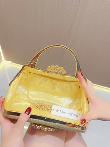 Golden rhinestone evening bag with elegant metal handle and detachable chain strap