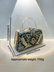 Pochette de soirée luxe noire avec strass, poignée dorée et motif soleil étincelant