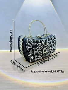 Sparkling black and silver rhinestone evening clutch bag with elegant silver handle
