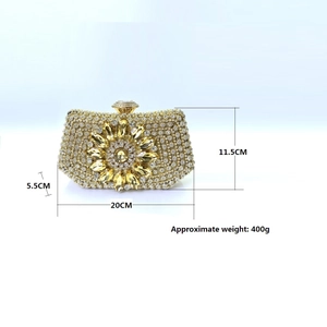 Detailed view of luxury gold rhinestone clutch bag showing 20x11.5x5.5cm dimensions