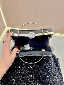 Black sequin evening clutch bag with gold ring handle and diamond clasp interior view