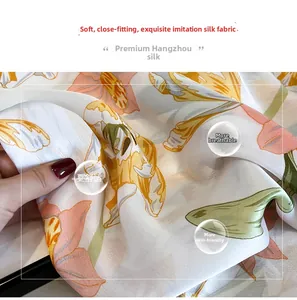 Macro shot of breathable silk-like fabric with vibrant lily print and soft texture