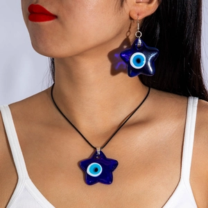 Detail of blue pentagram devil eye jewelry set with star pendant and matching earring