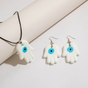 Detail of Hamsa Hand and Evil Eye jewelry set with necklace and hook earrings
