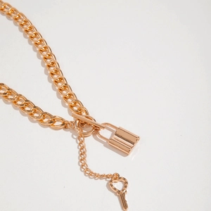 Gold cuban link chain necklace with heart key and lock pendant in vintage hip-hop style