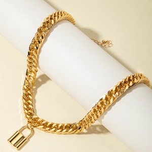 Detail of gold Cuban chain necklace with minimalist padlock pendant on white display stand