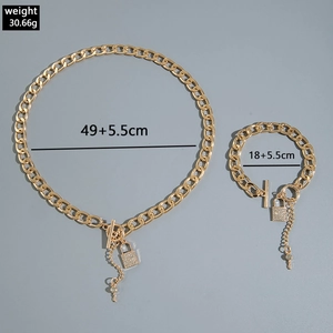 Macro shot of gold hip hop necklace set showing length and weight specifications