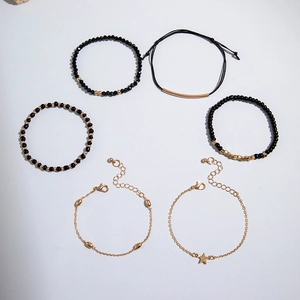 Lot de 5 bracelets bohèmes rétro avec perles noires et breloques étoiles dorées