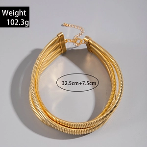 Detail of wide gold multi-layer snake chain choker with lobster clasp and extension