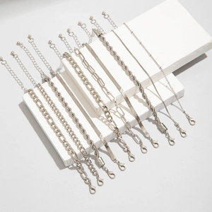 Detailed view of 10-piece silver chain bracelet set with various link textures and clasps