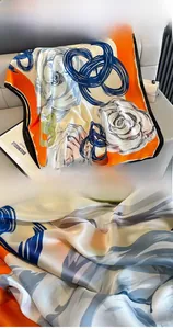 Detail of silk scarf with rose print featuring precise stitching and smooth texture
