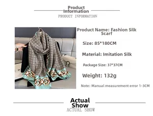 Detail view of large faux silk shawl with geometric pattern and 85x180cm dimensions