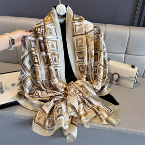 Elegant large silk-like scarf with geometric print and earthy tones for sun protection