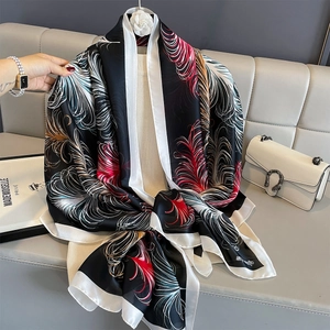Breathable summer silk scarf featuring elegant feather prints in black and red tones