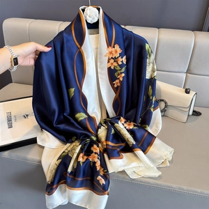 Elegant floral silk scarf in navy and cream with vintage orange flowers for sun protection