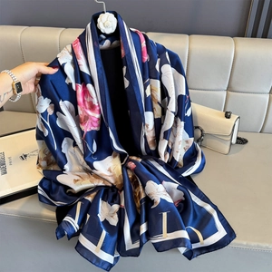 Elegant navy blue floral silk scarf with pink flowers and a modern border design