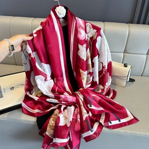 Elegant burgundy silk scarf with white floral print and decorative letter border