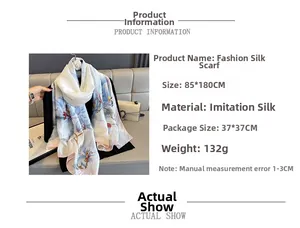 Detail showing printed floral satin scarf with 85x180cm dimensions and soft texture