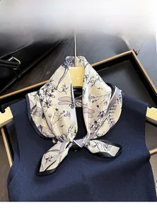Detail of 100% Mulberry silk scarf featuring vintage dragonfly print and black borders