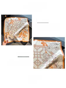 Macro detail of the floral print silk square scarf with fine machine hemmed edges